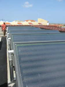 Patrick Robinson inspects integral collector-storage (ICS) solar hot water systems at a resort in Aruba. 