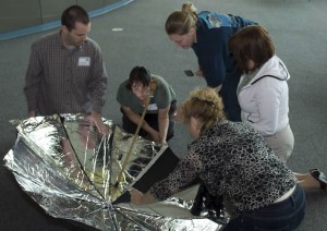 Teachers learn how to construct solar cookers from everyday items such as an umbrella.