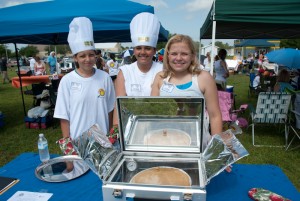 Students cook a dish in their solar oven and then judges taste-test it.