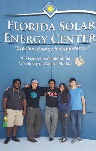 Students standing in front of Florida Solar Energy Center sign.