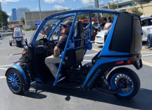 Blue, three-wheeled Archimoto electric sport utility vehicle